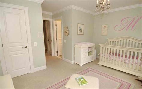 The sage accents add color to the nursery without being too bold. Sage green walls | Pink and green nursery, Light green ...