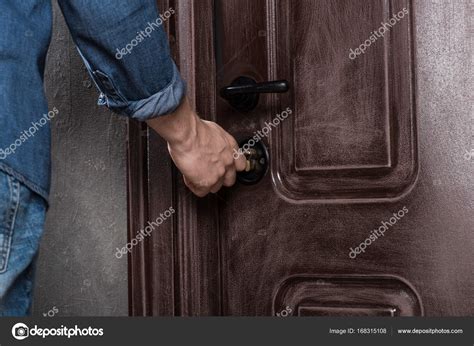 Man Opening Door Stock Photo By ©edzbarzhyvetsky 168315108