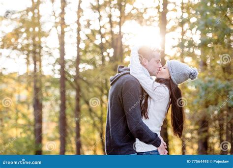 Beautiful Young Couple Hugging And Kissing Sunny Autumn Nature Stock