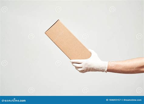 Man S Hand In Latex Gloves Presents A Cardboard Box Stock Image Image Of Pack Cardboard