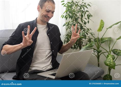 Deaf Or Hard Hearing Happy Smiling Young Caucasian Man Uses Sign