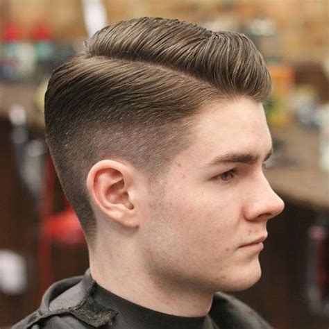 High fade with hard side part cut. Pin on hair