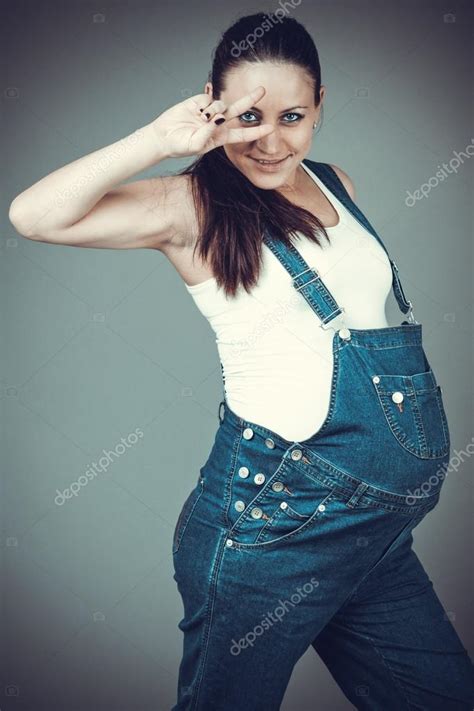 Pregnant Girl In Denim Overalls Stock Photo Ewastudio