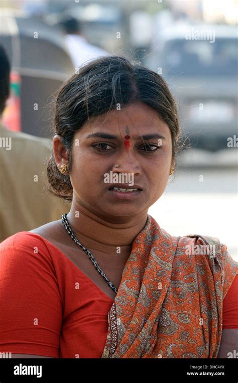 South Indian Village Woman In Red And Orange Sari With Sacred Tilac