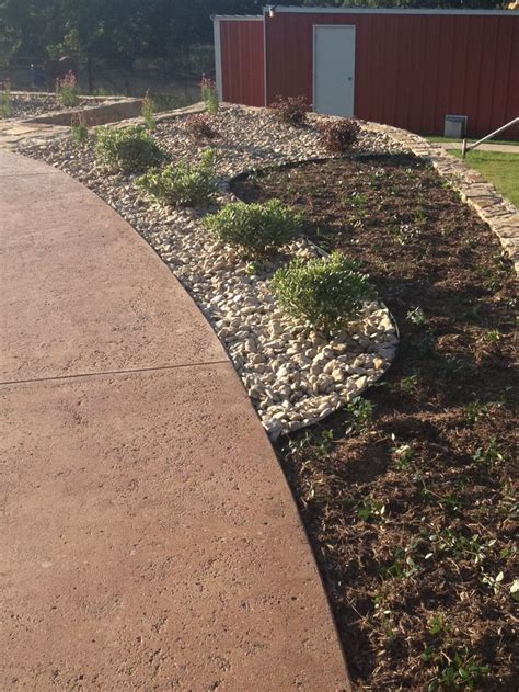 Maybe you would like to learn more about one of these? Flower bed design with river Rock and mulch. Very few ...