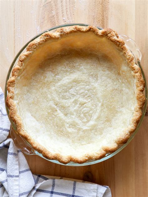 Then line with foil or parchment paper and fill with pie weights or dried beans. How to Blind Bake Pie Crust - Completely Delicious