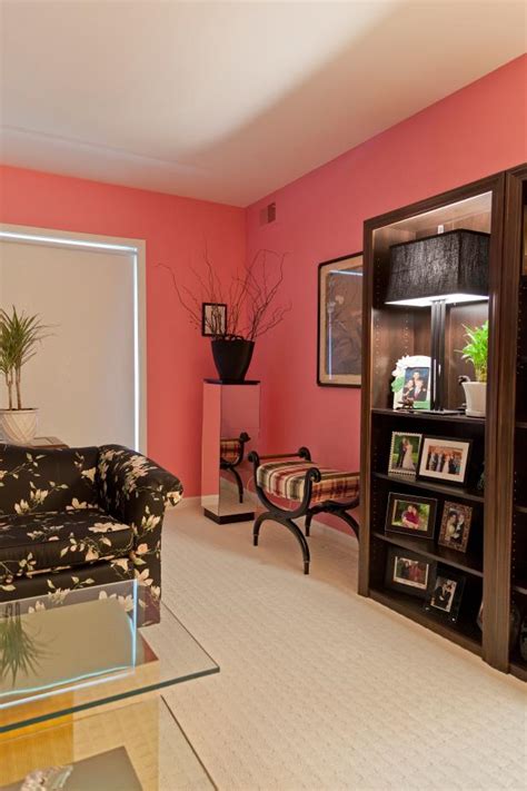 Browse living room decorating ideas and furniture layouts. Pink Living Room With Black Floral Sofa | HGTV