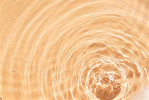 An Abstract Photo Of Water Ripples In The Sun