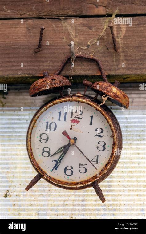 Old And Rusty Alarm Clock Hanging By A Nail In A Shed Kilwinning