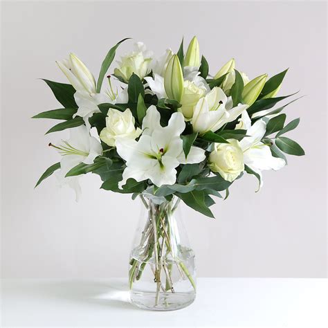 Oriental Lily And Rose This Elegant Pure White Bouquet Is Perfect In