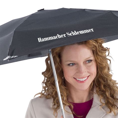 The Worlds Smallest Automatic Umbrella Hammacher Schlemmer