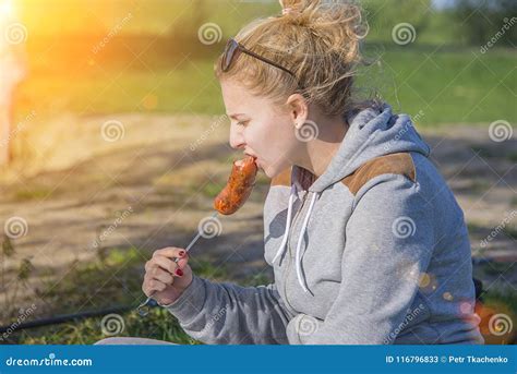 Girl Eating Sausage From The Grill Stock Image Image Of Food Natural