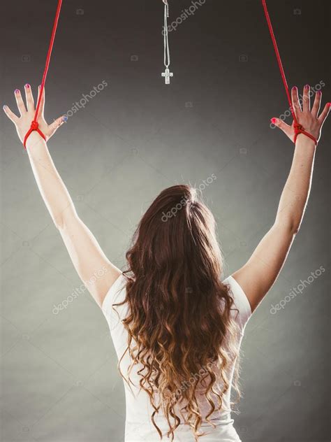 Tied Woman Forced To Worship Stock Photo Voyagerix
