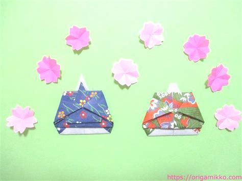 From 折り (おり, ori, folding) +‎ 紙 (かみ, kami, paper). お雛様の折り紙。簡単に子どもでも可愛いお雛様とお内裏様の ...