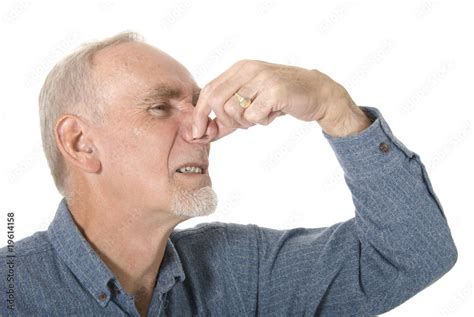 Old Man Pinching His Nose At Bad Smell Stock Photo Adobe Stock