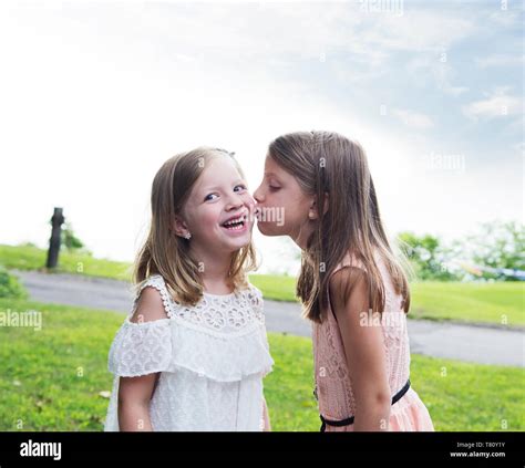 Two Young Sisters Kissing Hi Res Stock Photography And Images Alamy