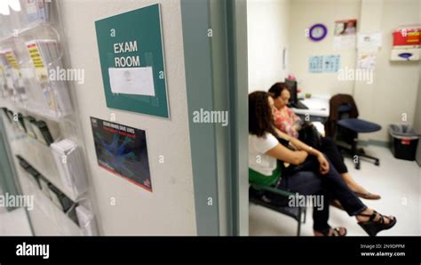 In This July 12 2012 Photo Two Women Wait In An Exam Room At Nuestra Clinica Del Valle In San