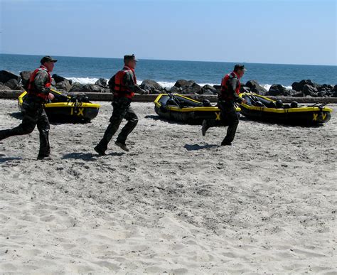 Navy Seals Navy Seal Trainees Run Toward The Ocean Rennett Stowe