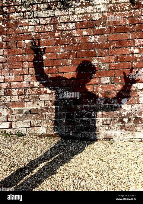 Shadow Of A Man On The Ground And Wall Stock Photo Alamy