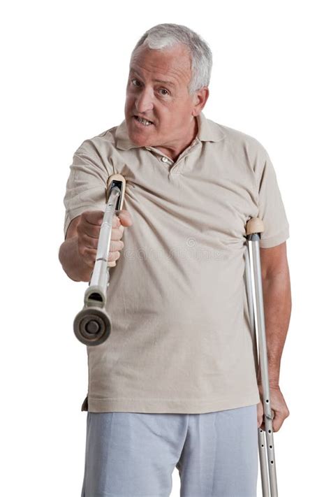 Man Holding Crutch Like A Weapon Stock Photo Image Of Caucasian