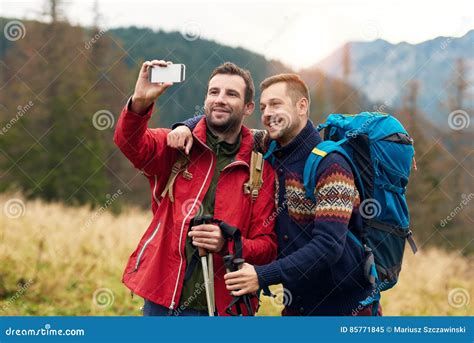 Hikers Taking A Selfie While Trekking In The Wilderness Stock Image