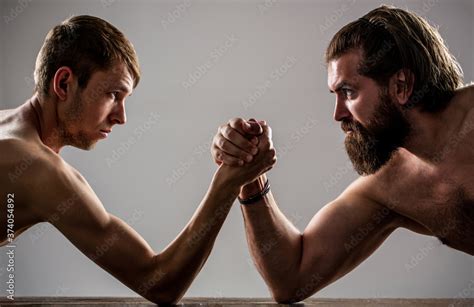 Arms Wrestling Thin Hand Big Strong Arm In Studio Two Man S Hands Clasped Arm Wrestling