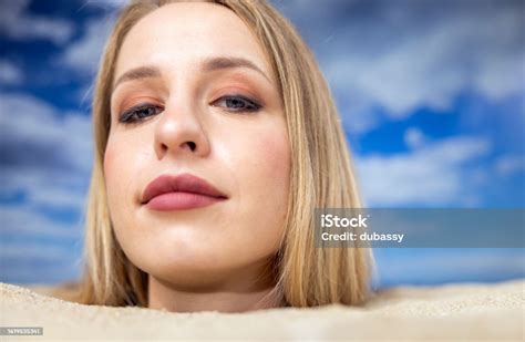 Woman Buried In Sand On Beach Stock Photo Download Image Now Adult