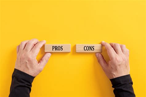 Comparing The Pros And Cons Options Hands Holding Wooden Blocks With