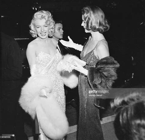 American Actress Marilyn Monroe Laughs With Fellow Actress Lauren