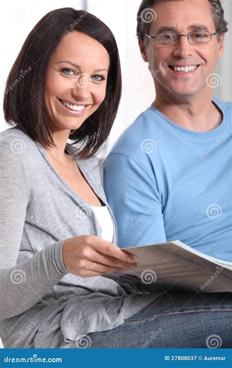 couple looking at photo album stock image image of home male 27808037
