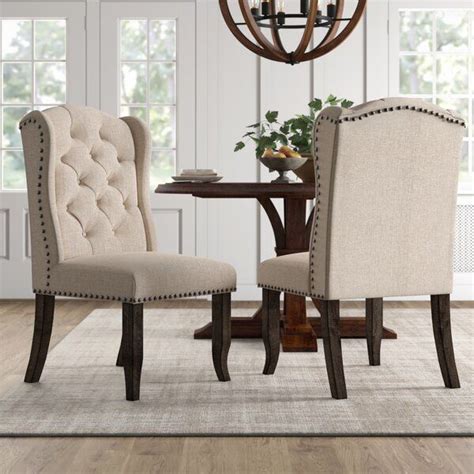 Lend an approachable, traditional accent to any seating ensemble with this jagger arm chair. Calila Tufted Upholstered Wingback Side Chair in Beige ...