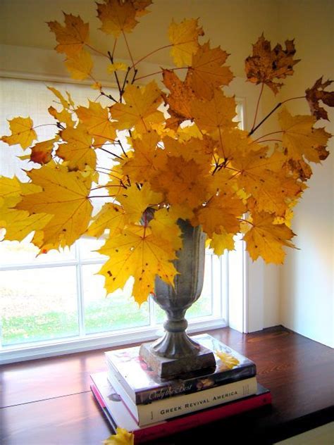 Isolated oak branches for fall decoration. 50 Beautiful Leaf Centerpieces Thanksgiving Decor Ideas