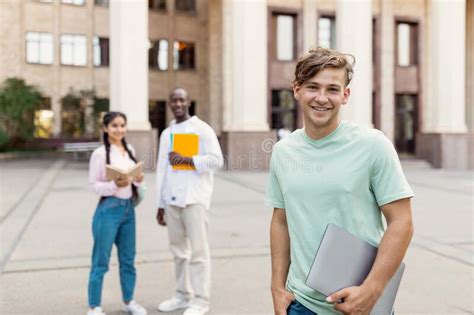 Happy Multiracial University Students Posing Outdoors Near University
