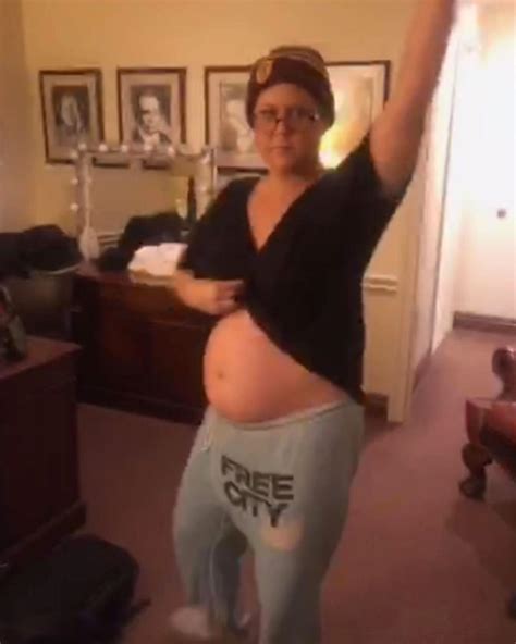 Pregnant Amy Schumer Shows Off Her Growing Baby Bump As She Postpones
