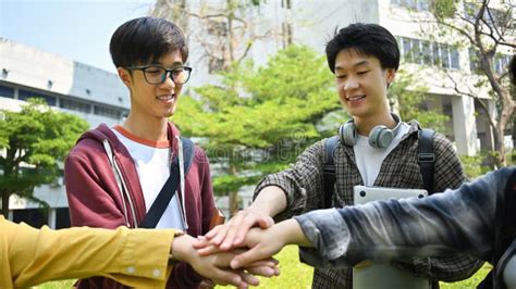 Group Of University Students Joining Hand Together Human Relationship