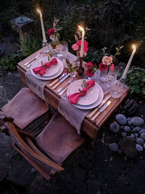 Romantic Table Setting Dining At Dusk With Candles And Flowers