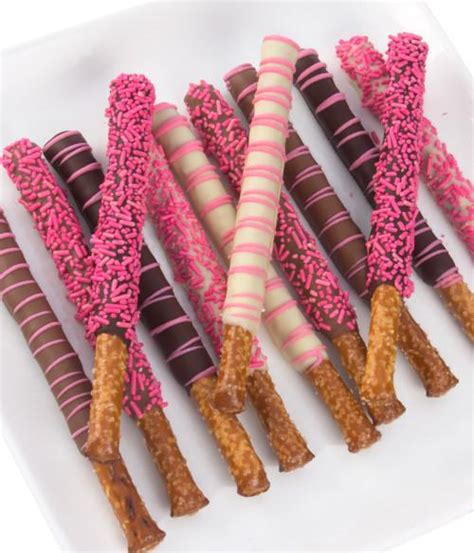 Dip pretzels in melted chocolate and place on a cooling rack over a sheet of waxed paper to catch drips. Chocolate Covered Company® | Pink Chocolate Covered ...