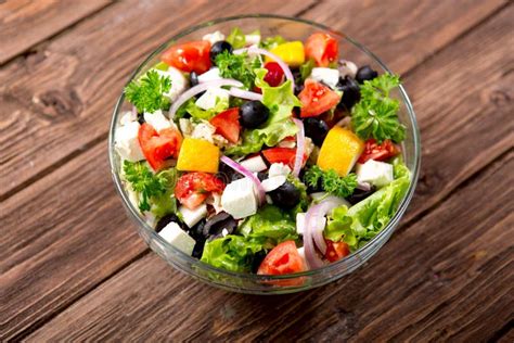 Fresh Vegetable Salad In Bowl With Fresh Lettuce Tomatoes And Cucumber