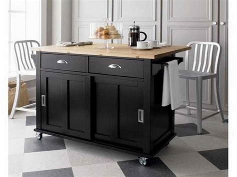 The kitchen of a long island home renovated by designer daniel sachs and architect kevin lindores includes 1920s american pendant lights over the island and a bespoke copper hood; Fascinating Kitchen Islands Wheels For Small Kitchens With ...