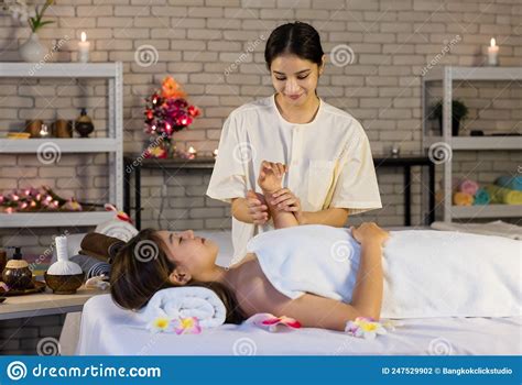 Asian Young Professional Oriental Masseuse Therapist Standing Massaging
