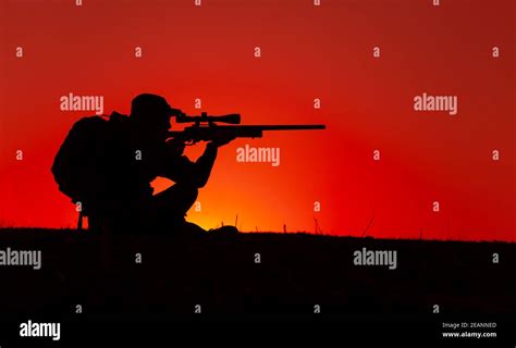 Commando Sniper Aiming Shooting Rifle On Seacoast Stock Photo Alamy