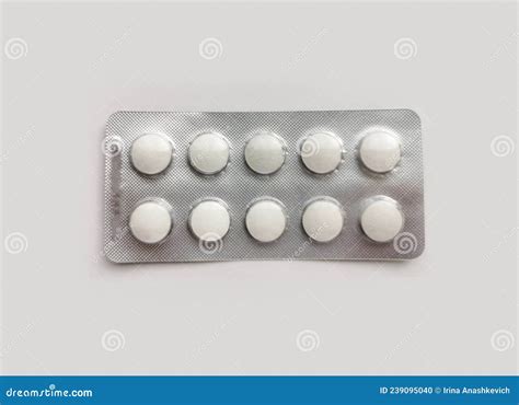 White Pills in Pack on Light Gray Background. Disease Treatment. the