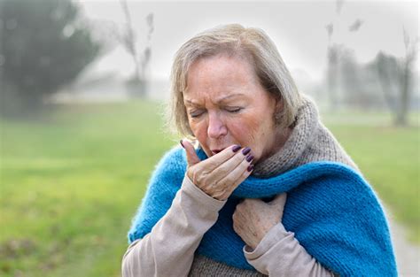 Elderly Stylish Woman Coughing Or Sneezing Stock Photo Download Image