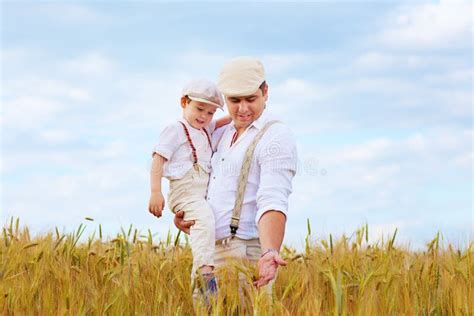 Father And Son Farmers On Wheat Field Stock Photo Image 41736124