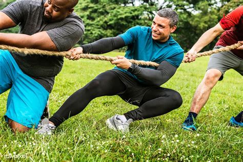 Download Premium Image Of Team Competing In Tug Of War By Teddy About