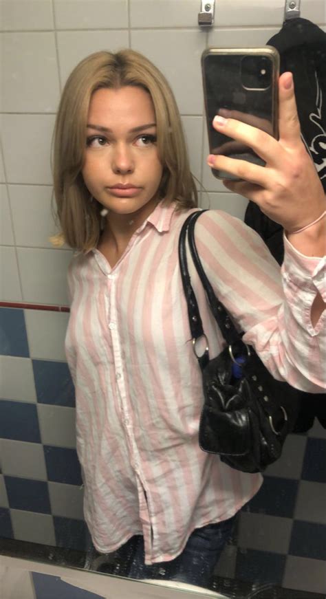 A Woman Taking A Selfie In The Bathroom