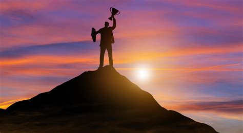 Victory Businessman With Trophy On Top Of Mountain Success Achieving
