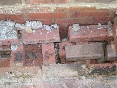 Fixing loose clutching bricks, but without a real answer. Nashville Home Inspection - Poor Brick Step System ...