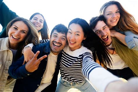Happy Multiracial Group Of Young Friends Taking A Selfie Together Outdoors Stock Image Image