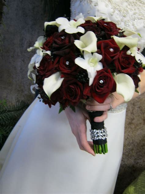 Bridal cascade wedding bouquet red ,black and white measuring about 14 long and 10 wide. Hand tied bridal bouquet with mini calla and black magic ...